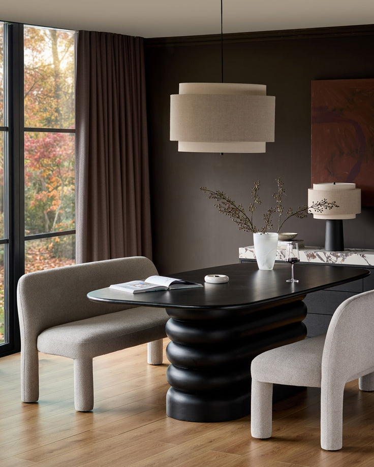 Mason 3-seater dining bench in light grey boucle, shown in modern dining setting with black table and matching chairs.