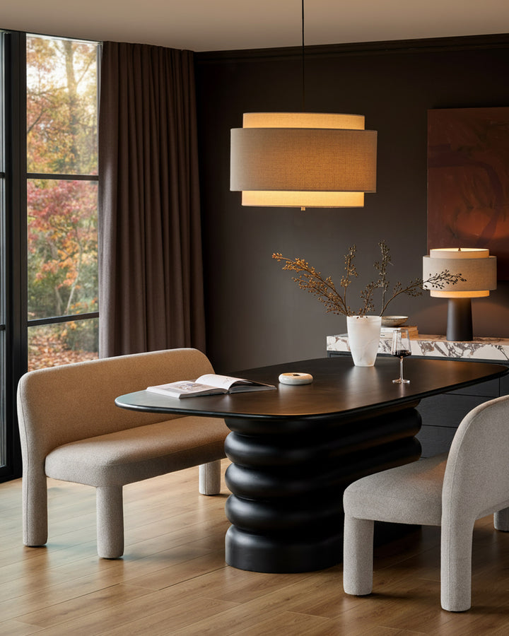Mason 3-seater dining bench in light grey boucle, shown in modern dining room setting with black table.