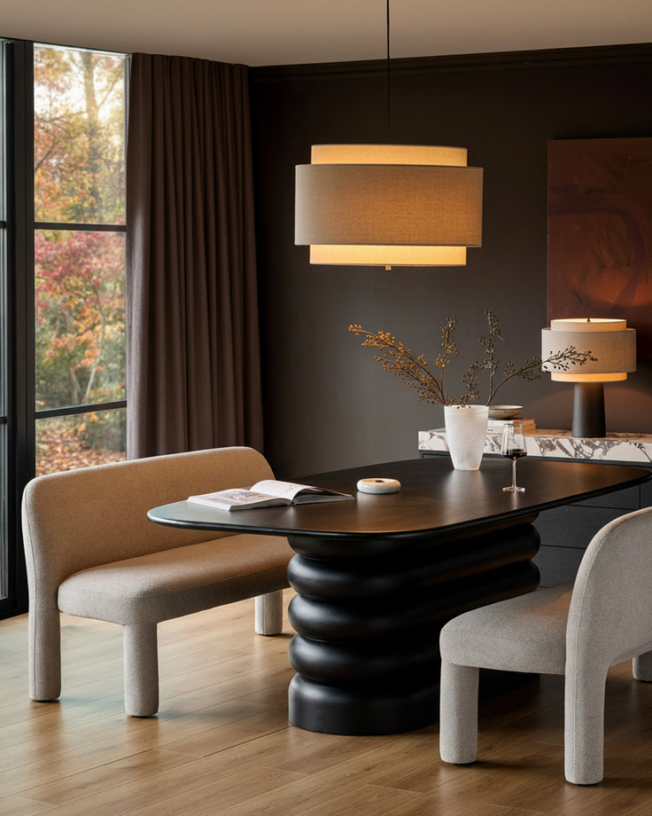 Mason 3-seater dining bench in light grey boucle, shown in modern dining room setting with black table.