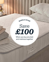 Taylor super king ottoman bed in mid-grey fabric with white pillows and bedding, styled in a bedroom setting.
