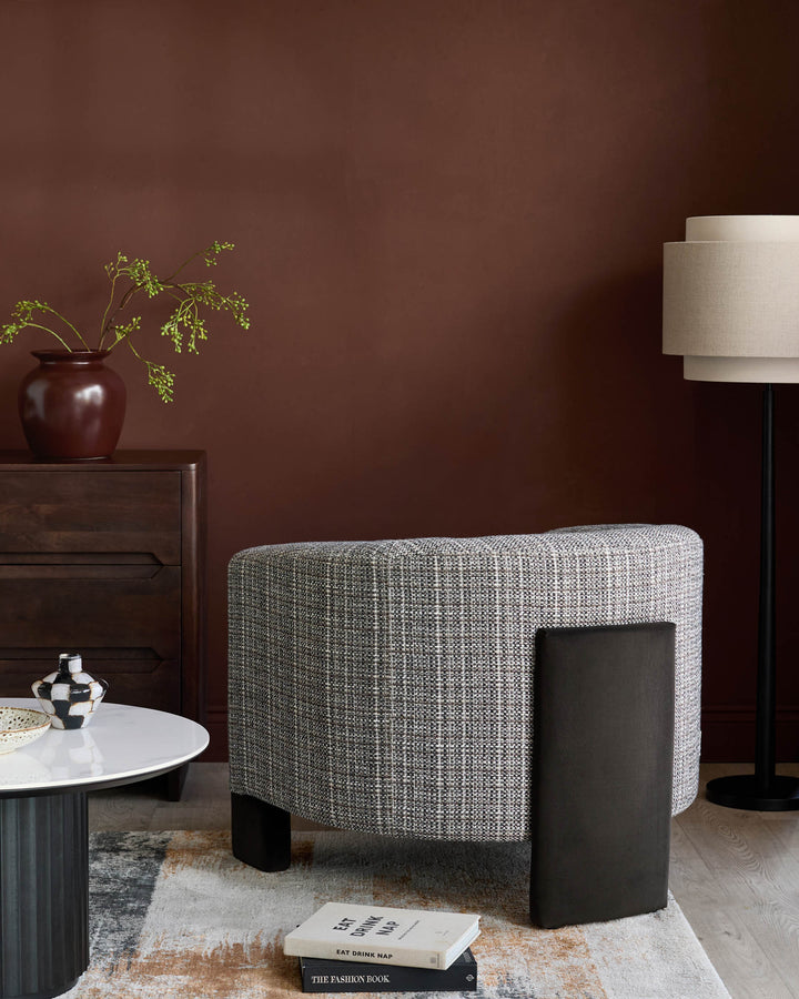 Miles occasional chair in light Grey fabric with dark chocolate velvet side panel, shown in modern interior setting.