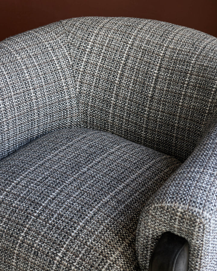 Miles Occasional Chair in dark chocolate fabric, showing curved armrest and textured upholstery detail from above.