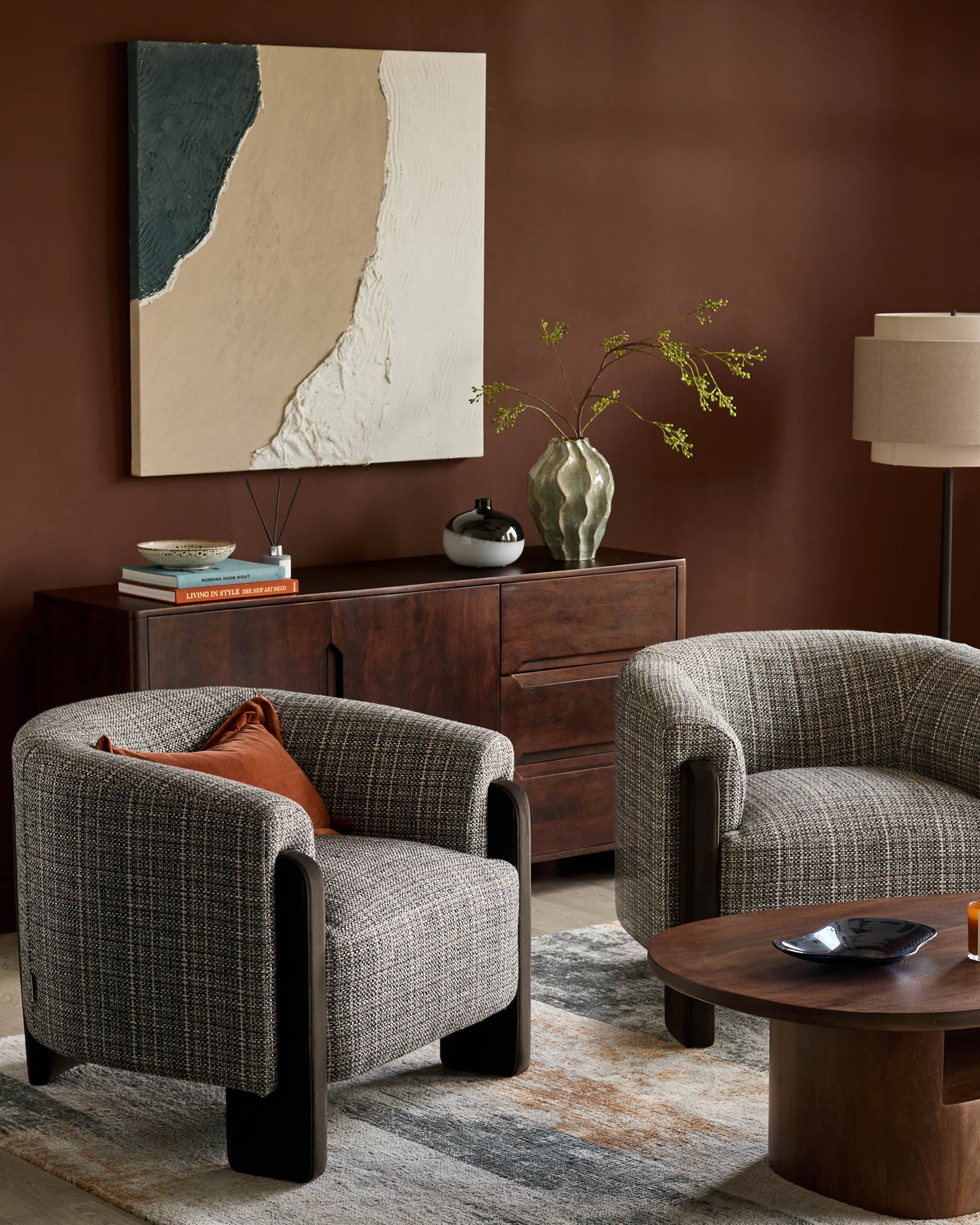 Miles Occasional Chair in Grey textured fabric with dark wood legs, shown in a styled living room setting.