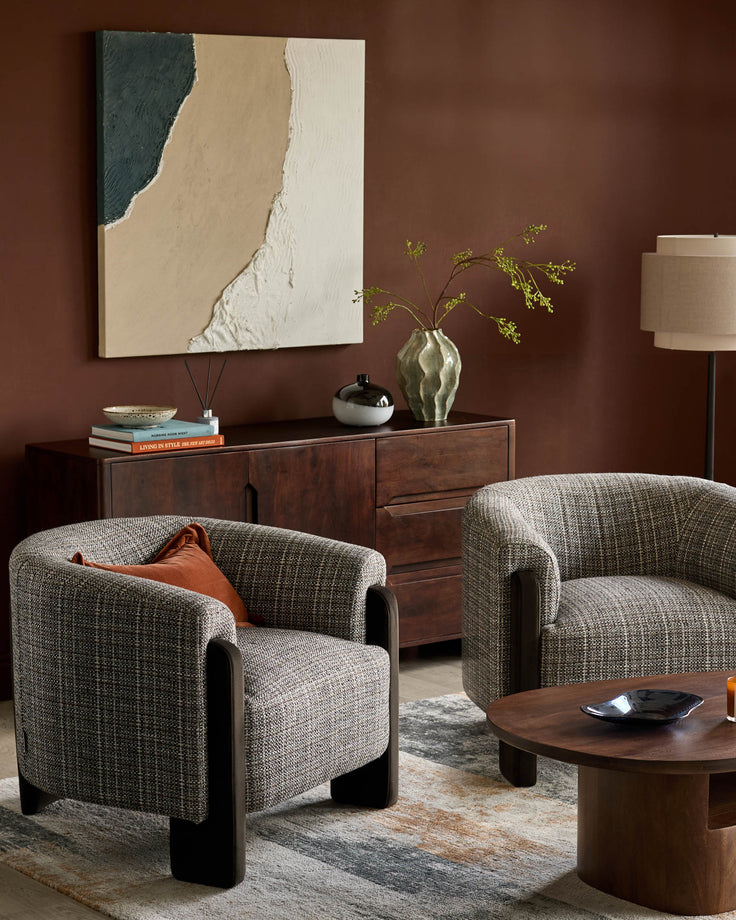 Miles Occasional Chair in Grey textured fabric with dark wood legs, shown in a styled living room setting.