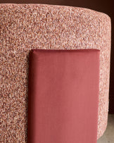 Miles occasional chair in toffee red fabric with burgundy velvet cushion, curved cylindrical shape, close-up side view.