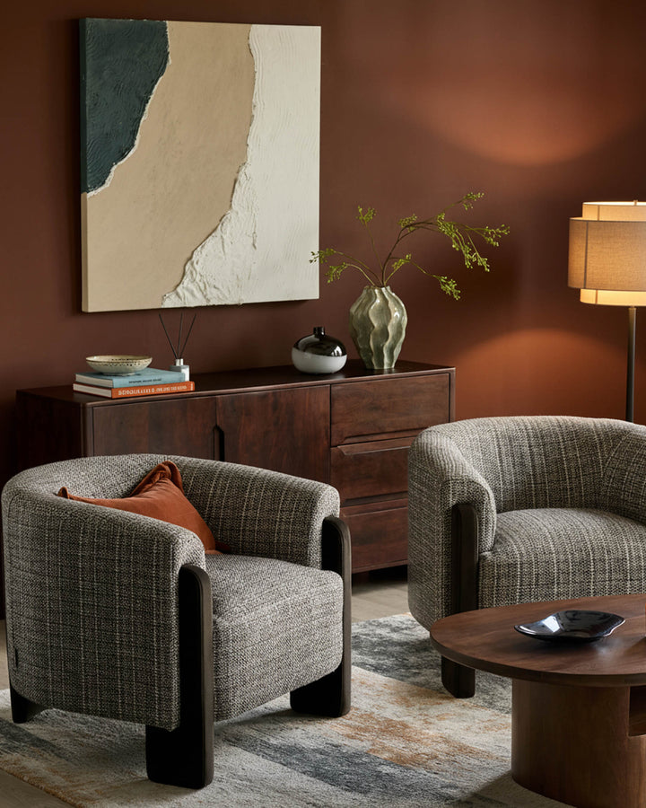Miles occasional chair in Grey textured fabric with dark chocolate velvet arms and legs, shown in room setting.