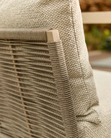 Close-up of natural woven fabric and wooden slat detail on corner bench with square handle accent.