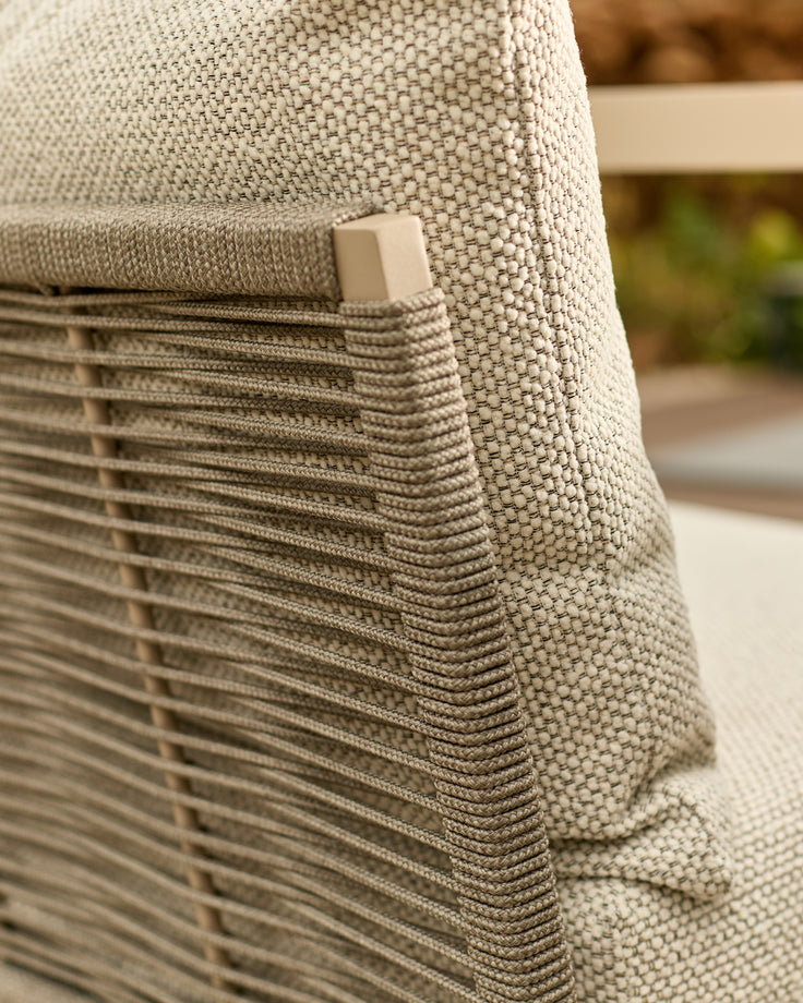 Close-up of natural woven fabric and wooden slat detail on corner bench with square handle accent.