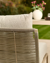 Minori garden corner bench in natural color, showing close-up of woven seat texture and slatted backrest detail.