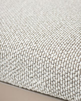 Close-up of natural cream woven fabric texture on dining bench seat with subtle gray stitching detail.