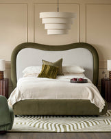 Naomi king-size ottoman bed in olive-green velvet with curved headboard and natural linen upholstered backrest.