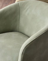 Natalia sage green faux leather swivel accent chair