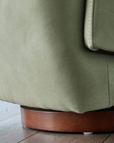 Natalia sage green faux leather swivel accent chair