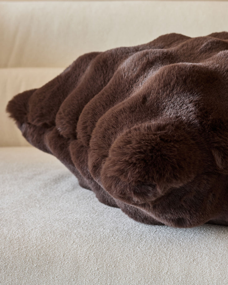 Nova Cushion Large in chocolate brown, showing plush textured fabric with gathered ruching detail and soft, comfortable appearance.