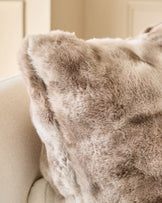 Large natural Nova cushion with soft, textured taupe fabric, displayed on a light cream sofa.