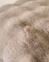 Close-up of taupe Nova large cushion showing soft, textured fabric surface with subtle color variations.