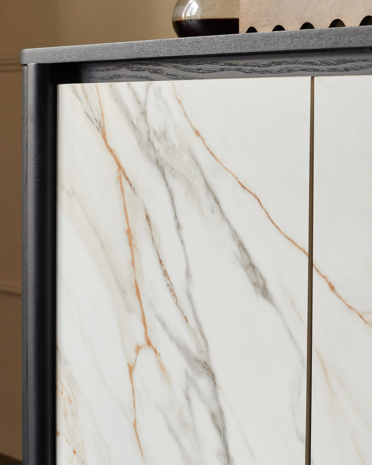 Marble-effect cabinet with a sleek, dark wood frame, offering a modern storage solution with a luxurious touch.