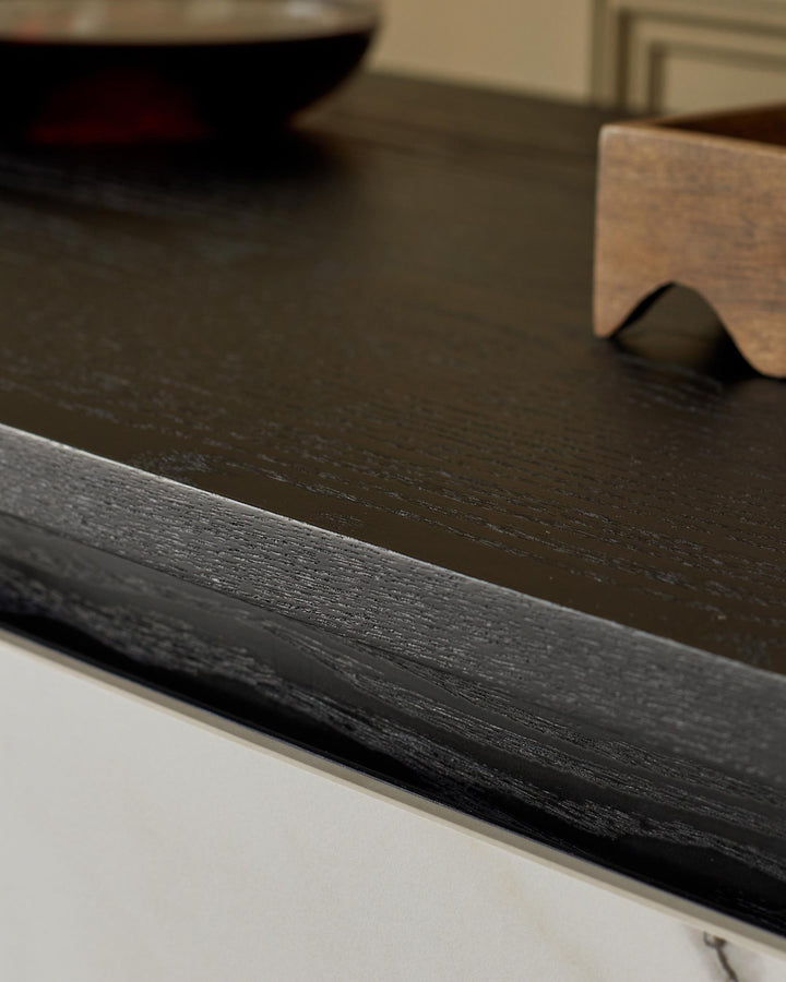 Close-up of a stylish dark wood cabinet with a sleek design, showcasing quality craftsmanship.