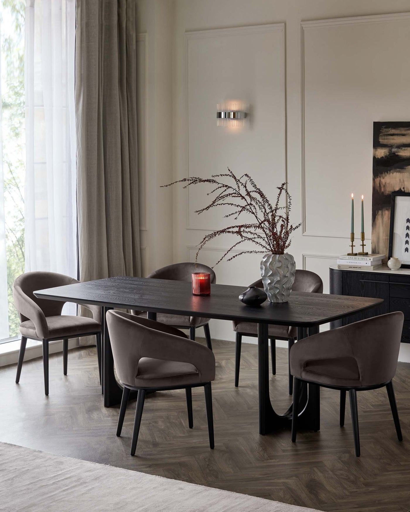 A contemporary dining set featuring a dark wooden table with an organic edge design and sturdy, u-shaped legs. Accompanied by five plush upholstered chairs with a smooth, rounded backrest and slim black metal legs. The set presents a sophisticated, modern aesthetic suitable for elegant interior dining spaces.