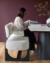 Contemporary dining set featuring a marble-effect table and stylish grey upholstered bench with black frame, offering a modern look.