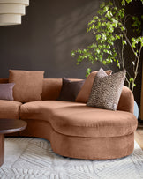 Ottilie right-hand corner chaise sofa in apricot fabric, curved design with decorative pillows in neutral tones.