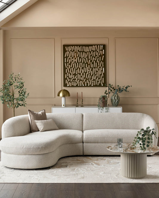 Ottilie left-hand corner chaise sofa in natural fabric, curved design, displayed in neutral living room setting.