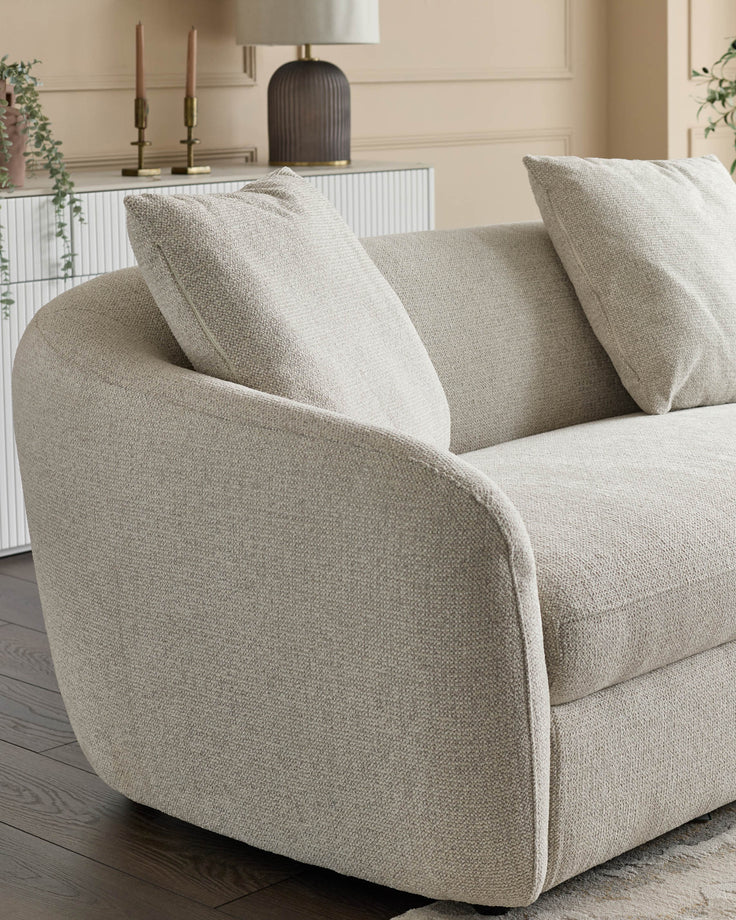 Ottilie right-hand corner chaise sofa in natural fabric, showing curved arm detail and coordinating scatter cushions.