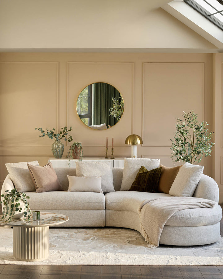 Ottilie right-hand corner chaise sofa in natural fabric, curved design with multiple cushions in a modern living room setting.