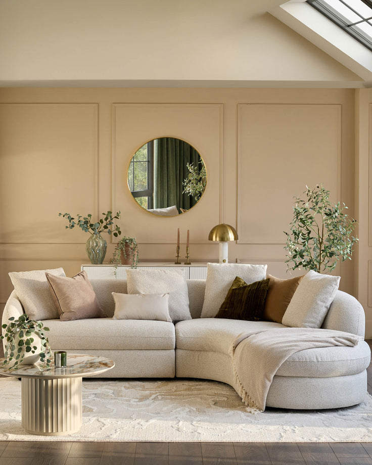 Ottilie right-hand corner chaise sofa in natural fabric, curved design with multiple cushions in a modern living room setting.