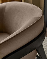 Palmer Occasional Chair in Mocha fabric, angled side view showing curved backrest and black wooden base frame detail.