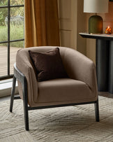 Palmer occasional chair in mocha fabric with dark wooden frame, featuring a brown pillow, positioned in a styled living room setting.