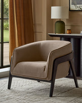 Palmer occasional chair in mocha fabric with black wooden legs, shown in a styled living room setting.