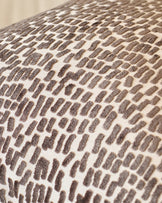 Payton cushion large in chocolate, close-up of textured woven fabric with brown and cream geometric pattern.