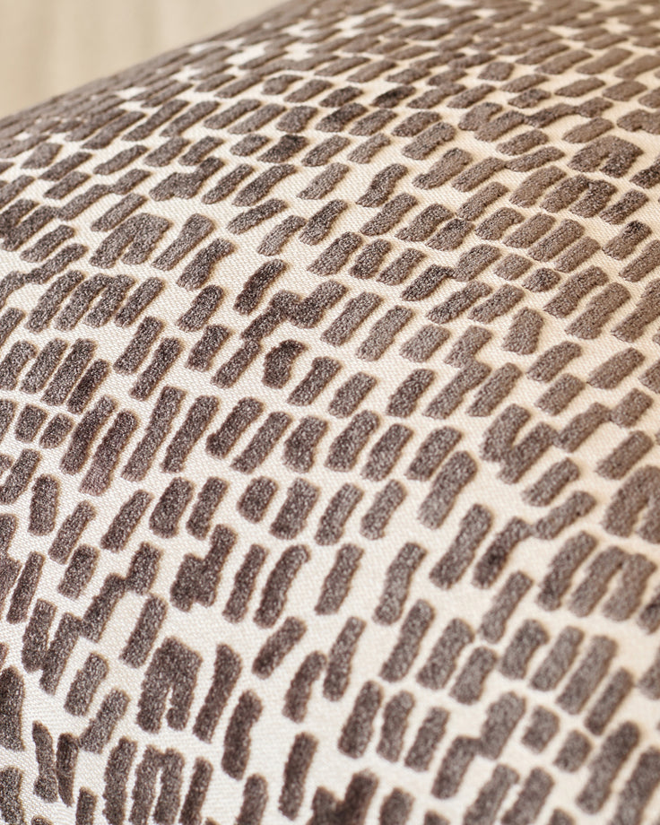 Payton cushion large in chocolate, close-up of textured woven fabric with brown and cream geometric pattern.