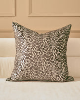 Payton Cushion Large in Chocolate - square pillow with brown and cream textured pattern, displayed on cream sofa.