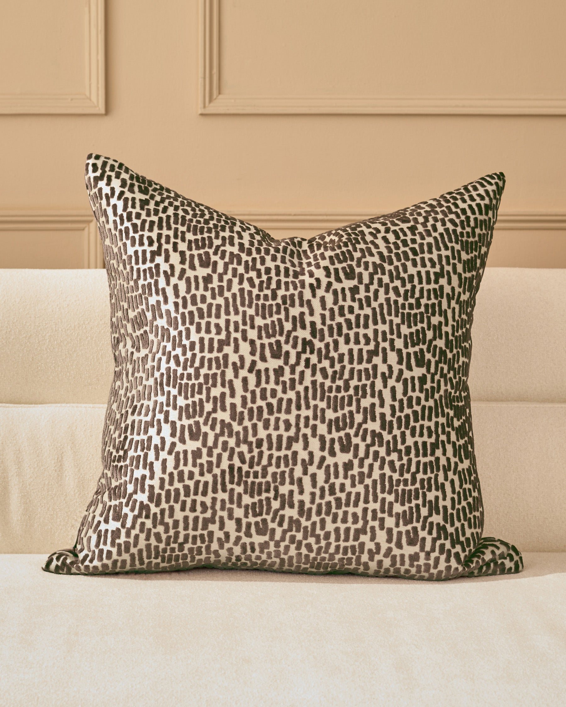 Payton Cushion Large in Chocolate - square pillow with brown and cream textured pattern, displayed on cream sofa.