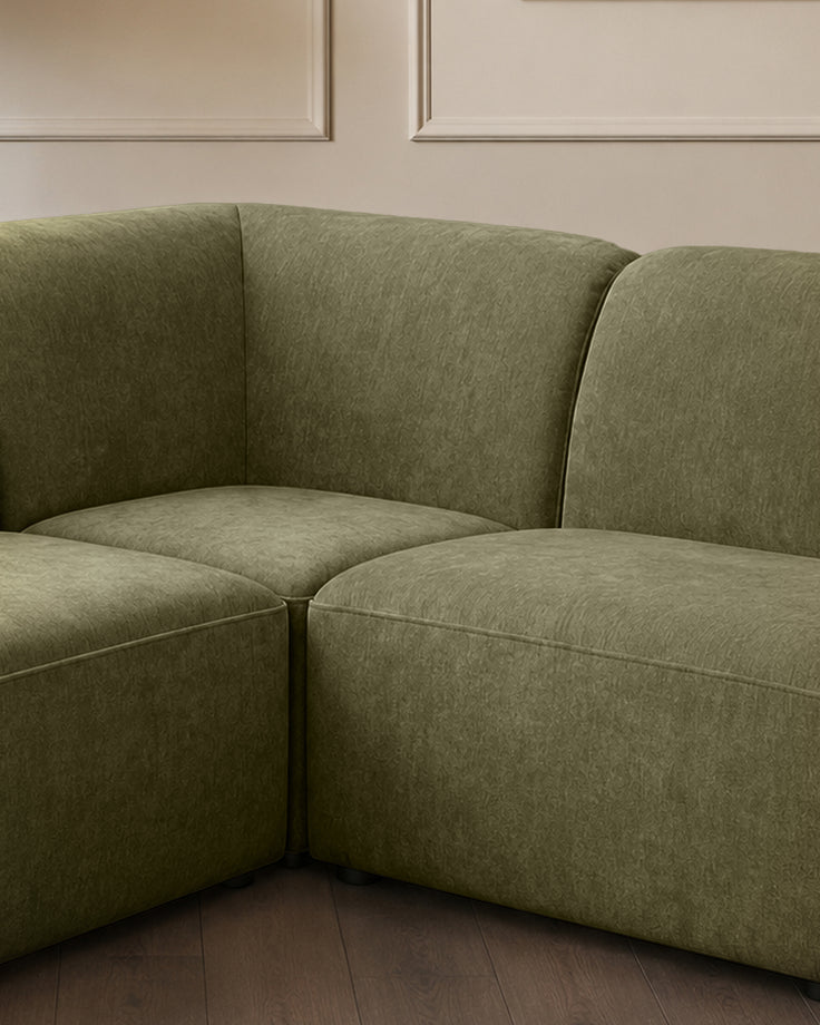 Penny dark green fabric large corner sofa