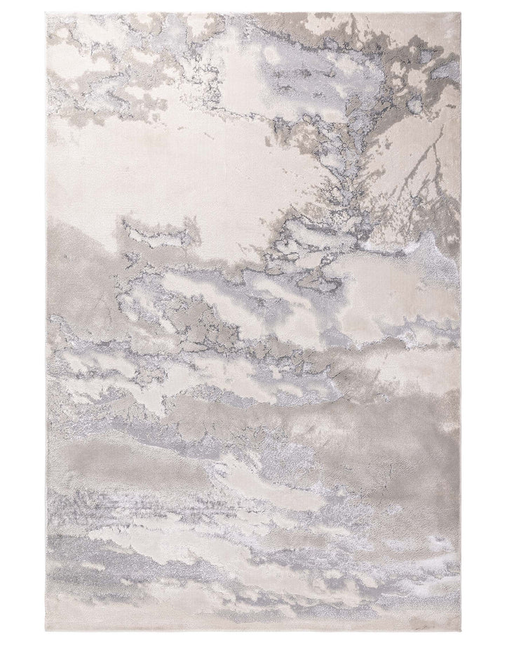 A neutral coloured rug with a marbled effect in soft shades of beige, grey and silver.