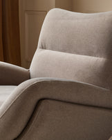 Piper accent chair in mocha fabric, showing curved backrest and armrest from side angle in warm interior setting.