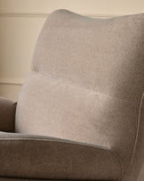 Piper accent chair in mocha fabric, shown from side angle highlighting curved backrest and cushioned seat detail.
