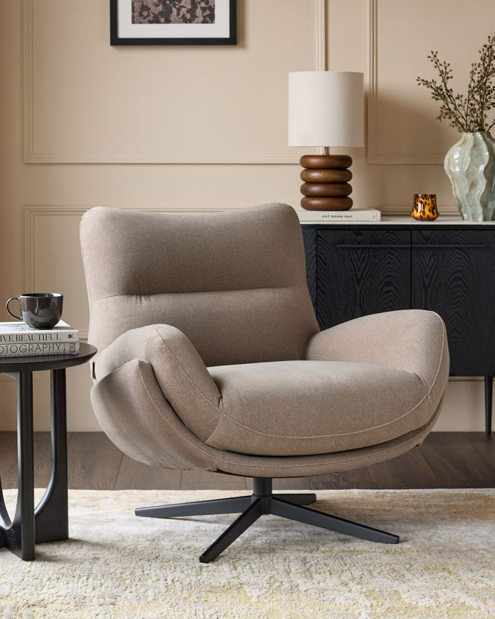 Mocha fabric accent chair with curved arms and high back on black swivel base, displayed in styled living room.