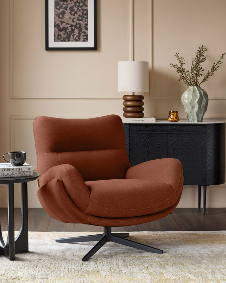 Toffee-red Piper accent chair with curved arms and black swivel base, displayed in a styled living room setting.