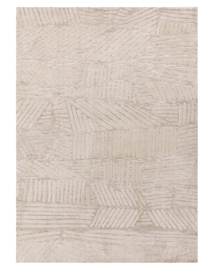 Abstract patterned rug in neutral tones. A stylish floor covering for any room.