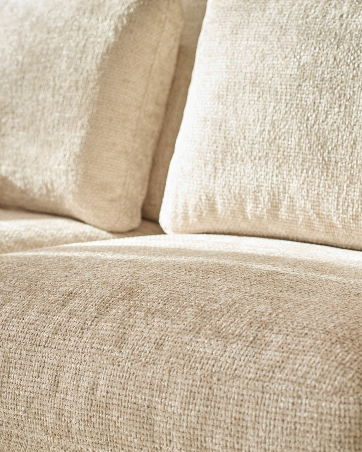 Quinn 2-seater sofa in natural fabric, close-up detail showing textured weave and cushions.