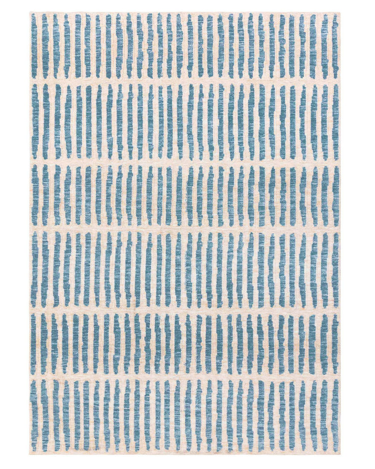 A patterned rug with blue vertical stripes on a cream background, ideal for adding texture and interest to any room.