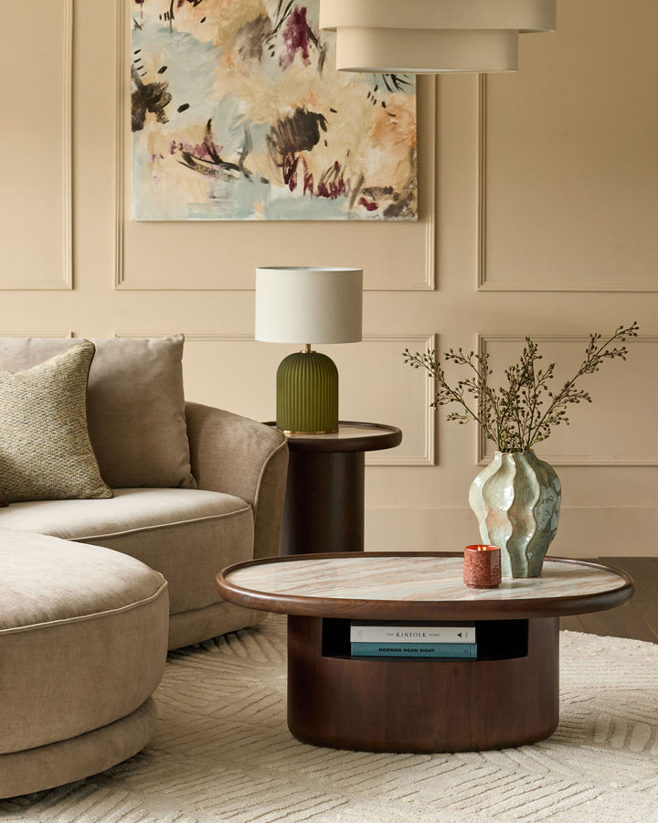 Rayna dark wood coffee table with Toronto marble top in modern living room setting, round shape with open shelf storage.