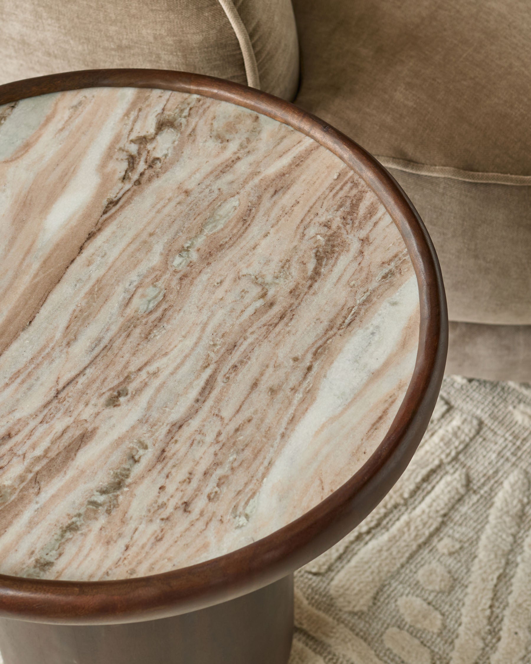 Rayna side table with dark wood frame and light marble top, viewed from above at an angle.