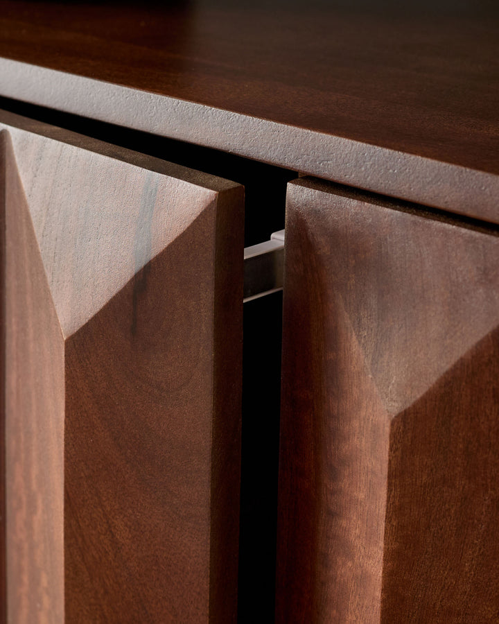 Dark mango wood sideboard with angled door detail and recessed handle, showing rich wood grain and finish.