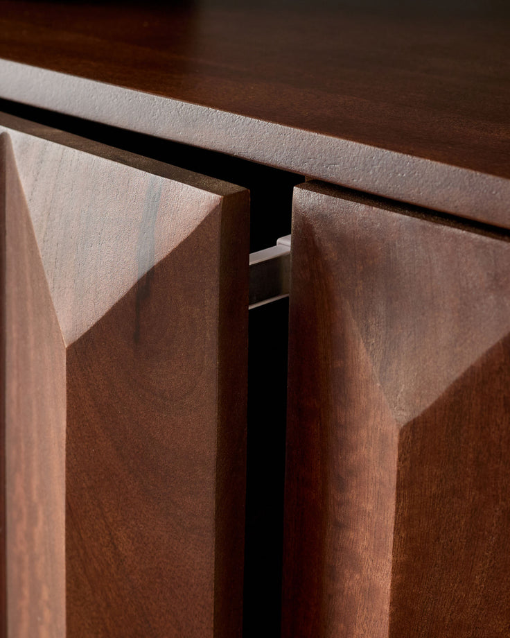 Dark mango wood sideboard with angled door detail and recessed handle, showing rich wood grain and finish.
