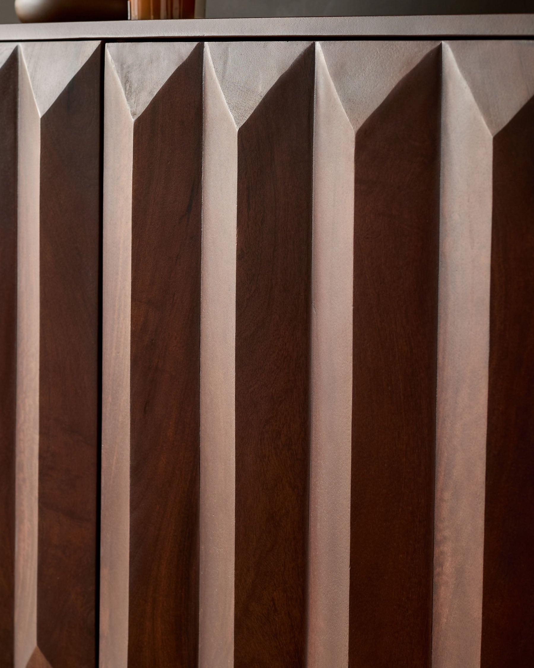 Dark mango wood sideboard with geometric fluted front panels and clean linear design details.